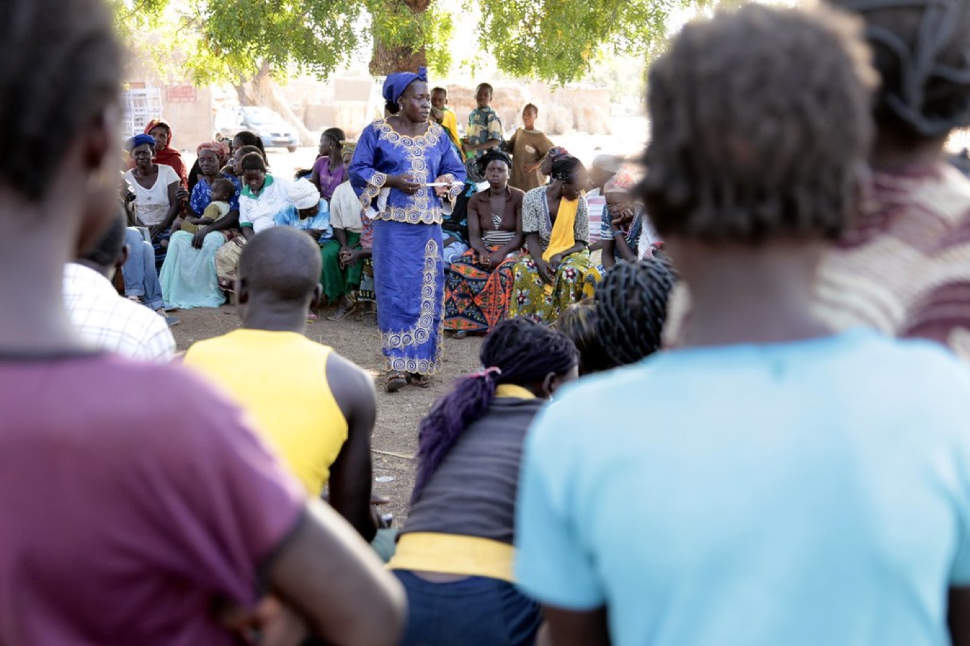 Community members gathered for a village dialogue session
