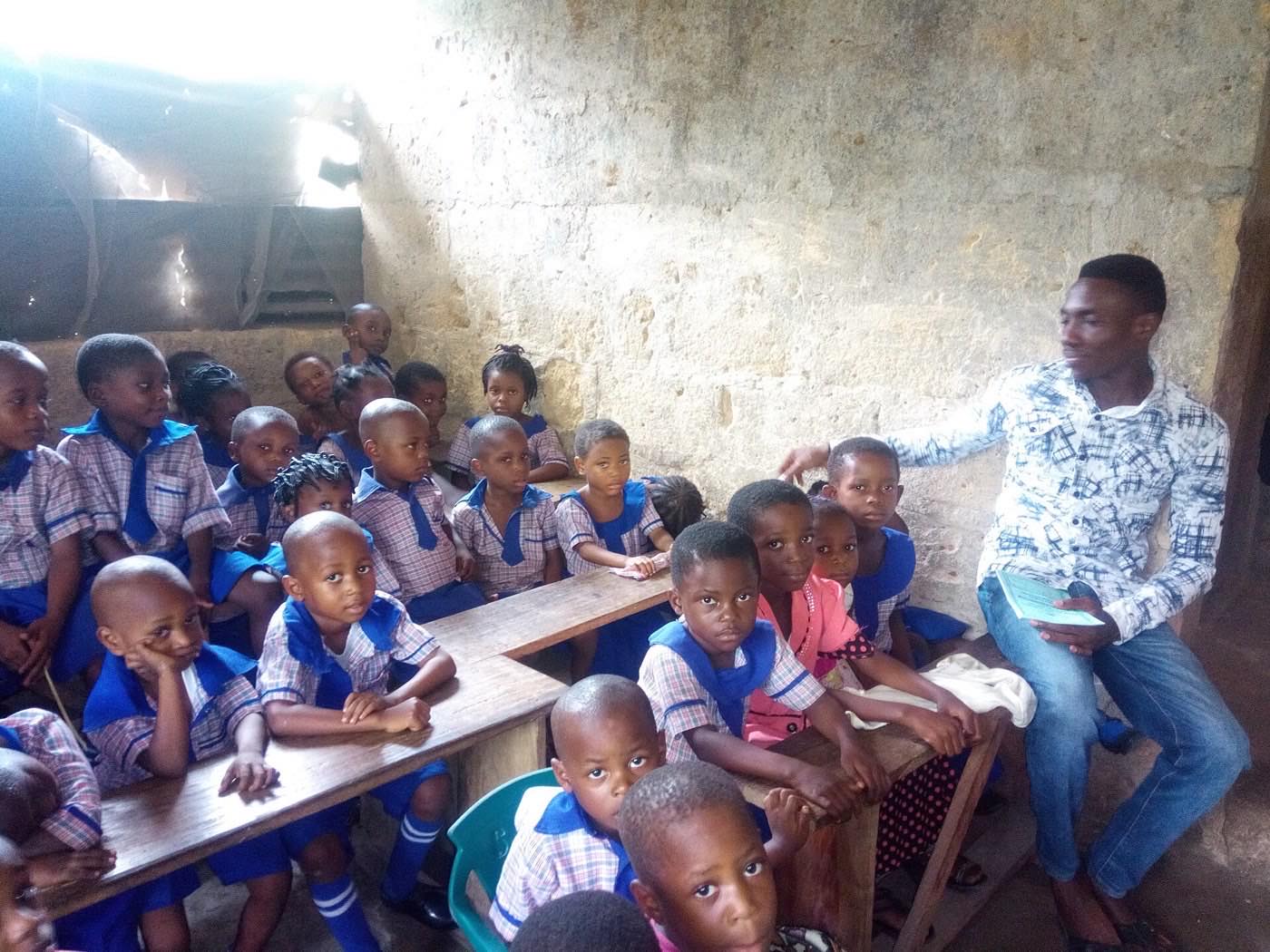Nursery school pupils with their teacher in a classroom